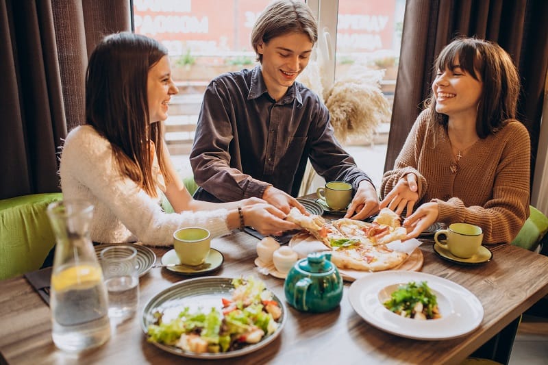 Why is it important to sit down while eating?